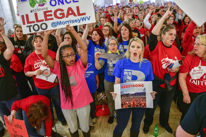 Florida law doesn't permit teacher to strike like their counterparts in West Virginia, but Volusia teachers plan to march to and rally outside a School Board meeting Tuesday to demand better pay and work conditions. Union leaders worry the county could lose good teachers from the profession. District officials say they are limited by meager funding from the state. [AP Archives]