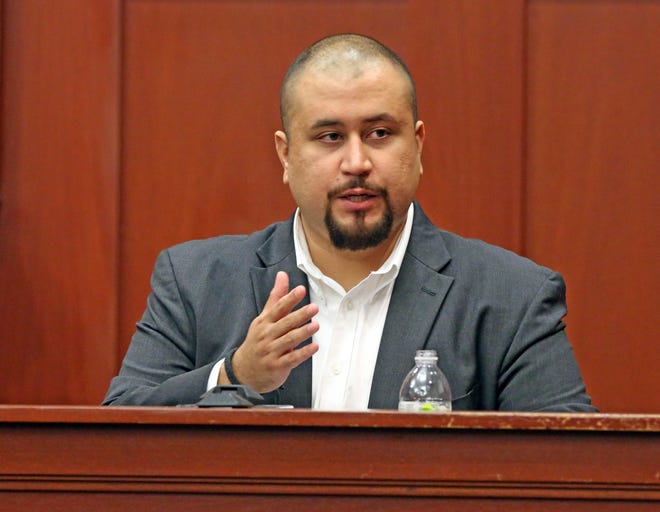 In this Sept. 13, 2016 file photo, George Zimmerman looks at the jury as he testifies in a Seminole County courtroom in Orlando, Fla. Authorities say Zimmerman threatened a private investigator working for a documentary filmmaker. Court records show Zimmerman was issued a summons for a May 30, 2018 arraignment on a charge of misdemeanor stalking. (Red Huber/Orlando Sentinel via AP, Pool, File)