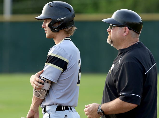 North Gaston's Austin Mitchell (2) talks to Wildcats assistant coach Brent Mellon during last Friday's 8-3 loss at Crest in the Big South 3A tournament title game at Crest High School. [JOHN CLARK/THE GASTON GAZETTE]
