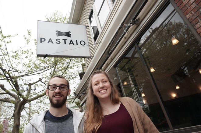 Pastaio in Providence will close later this month. Co-owners Adam Baffoni and Bethany Caliaro stand in front of the restaurant on Westminster Street on the West Side. [The Providence Journal file /Sandor Bodo]
