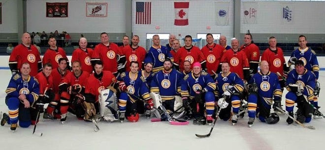 Members of the Taunton Police and Fire Departments, who played in a hockey game against one another in 2015 to raise money for Officer Evan Lavigne, who had been diagnosed with Hodgkin's lymphoma months prior. Lavigne decided to set up another charity game to benefit the families of a Taunton police officer, whose children are battling a rare disease, and a Taunton firefighter, whose sister is battling cancer. (Photo courtesy Evan Lavigne)
