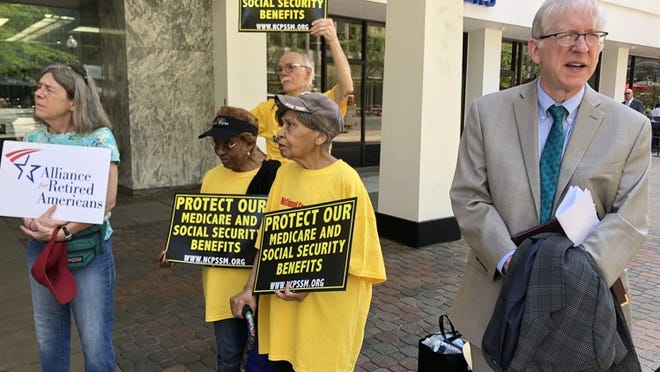 Demonstrators object to the planned closure of the Social Security office in Arlington, Va., on Thursday.
