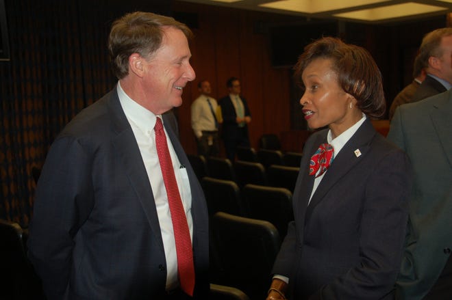 Amarillo City Council member Freda Powell shares a moment with Texas Tech University System Chancellor Robert Duncan after Tuesday's meeting in which the funding initiative for the university's veterinary school was approved. (Douglas Clark / Amarillo Globe-News)