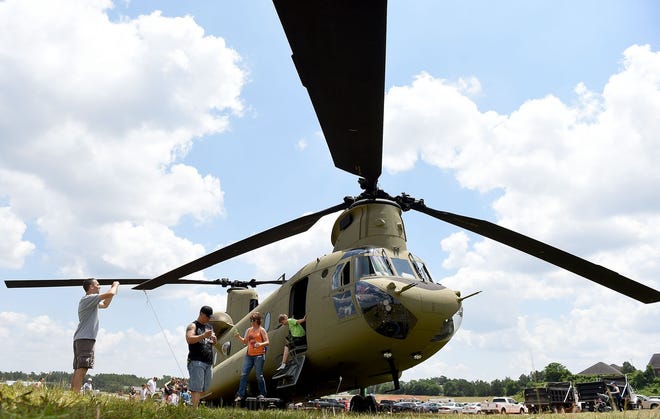 People check out a Chinook on display during the 2015 Thunder Over Augusta event. The annual event to honor the Armed Forces is now called Thunder Over Evans. [File/The Augusta Chronicle]