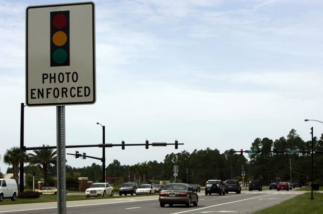 Stoplight cameras catch people that go through red lights by taking a picture of your license plate, such as the camera at the intersection of Easthampton Boulevard and Belle Terre Parkway in Palm Coast, which was removed in 2015. NEWS-JOURNAL FILE
