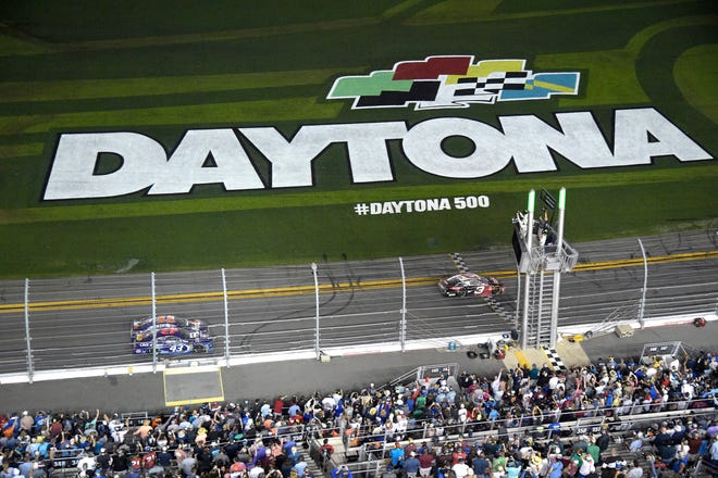 Austin Dillon (3) takes the checkered flag to win the NASCAR Daytona 500 auto race at Daytona International Speedway Sunday, Feb. 18, 2018, in Daytona Beach, Fla. (AP Photo/Phelan M. Ebenhack)