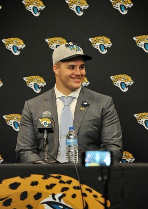 Taven Bryan answers questions from the media during an introductory press conference at EverBank Field. [Bob Self/Florida Times-Union]