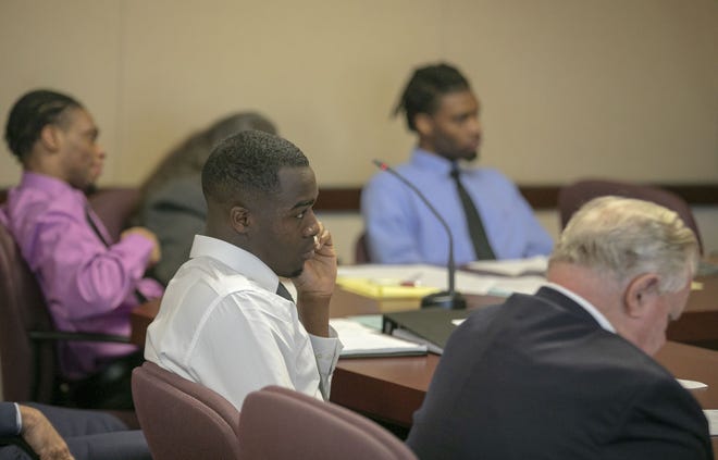 Defendants and their attorneys listen as jury selection begins in the felony murder trial of Kiila Tyrell Richardson, Travis Jamaar Davis, Branden J.M. Banks and Kelvon S. Grimmage at the Marion County Courthouse in Ocala on Monday. The men are accused of killing Courtney London in 2016 during a home invasion robbery. [Alan Youngblood/Ocala Star-Banner]