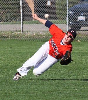 Pontiac right fielder Jakob Grieff dives for a blooper that landed for a double in the Indians’ 9-3 loss to Central Catholic Monday.