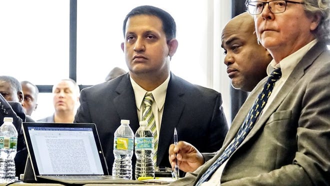 Nouman Raja, left, sits in court with his attorneys at the start of two days of “stand your ground” hearings Monday morning, May 7, 2018. Raja, a former Palm Beach Gardens police officer, is charged with shooting and killing Jones while Raja worked as an undercover officer. (Lannis Waters / The Palm Beach Post / POOL)