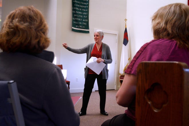 Margaret Paccione, a child psychologist, speaks to parents and caregivers at Lime Rock Baptist Church in Lincoln on Tuesday evening about ways to help children cope with tragedies such as school shootings. [The Providence Journal / Kris Craig]
