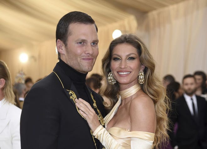 Tom Brady, left, and Gisele Bundchen attend The Metropolitan Museum of Art's Costume Institute benefit gala celebrating the opening of the Heavenly Bodies: Fashion and the Catholic Imagination exhibition on Monday, May 7, 2018, in New York. (Photo by Evan Agostini/Invision/AP) ORG XMIT: NYAH664