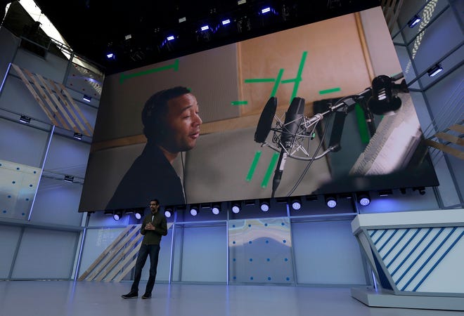 Google CEO Sundar Pichai speaks on Tuesday under a video showing singer John Legend at the Google I/O conference in Mountain View, Calif. [AP Photo / Jeff Chiu]