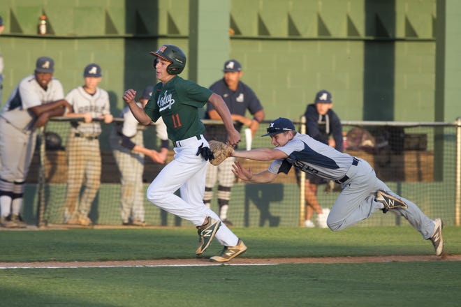Arnold third baseman Thomas Risalvato dives while tagging out Mosley courtesy runner Ethan Campbell in a rundown between third base and home during last week's district finals. Both teams are in action tonight in region quarterfinal games. [JOSHUA BOUCHER/THE NEWS HERALD]