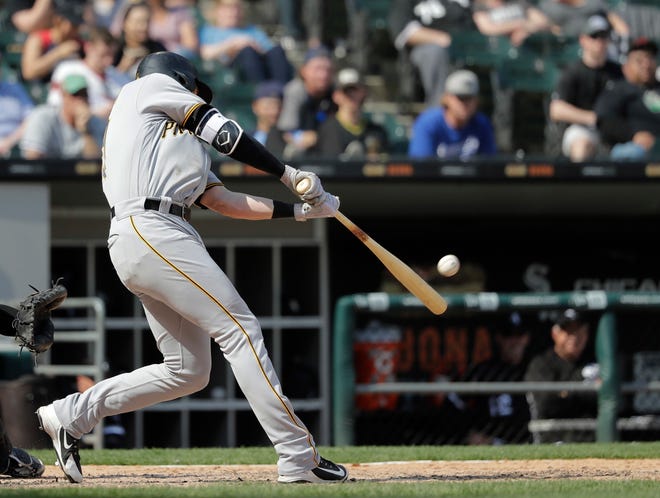 Pittsburgh Pirates' Colin Moran hits a two-run home run off Chicago White Sox relief pitcher Nate Jones during the ninth inning of a baseball game Wednesday, May 9, 2018, in Chicago. Elias Diaz also scored on the play giving the Pirates a 6-5 win over the White Sox. (AP Photo/Charles Rex Arbogast)