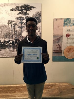 Jaylon Lowery with his award certificate. He was the second place winner in the THJHA Fall 2018 Magazine Article Contest.