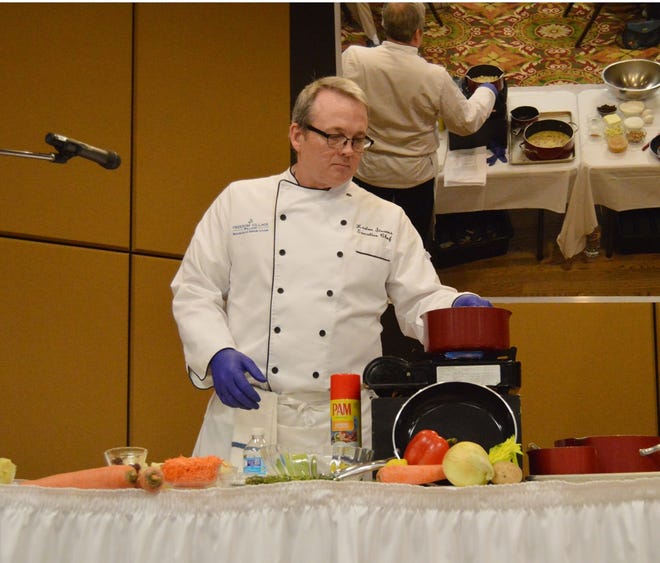 Chef Keaton Stearns demonstrates a recipe at last year's "Taste of Holland" luncheon. [SENTINEL FILE PHOTO]