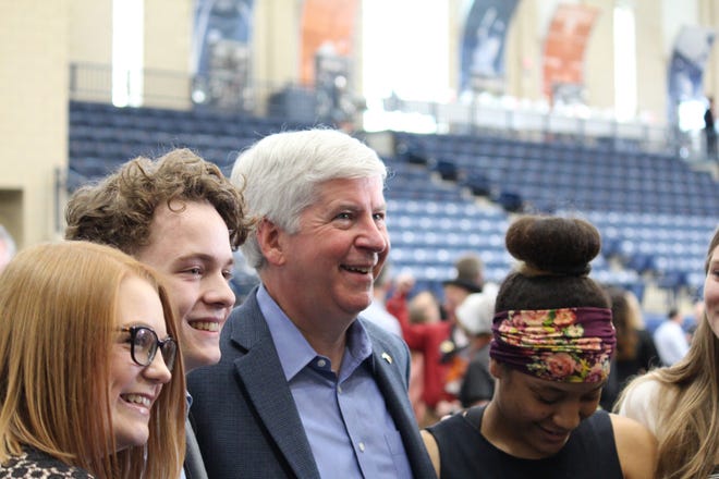 Gov. Rick Snyder, center, poses for a photo at the DeVos Fieldhouse in Holland after the Tulip Time Luncheon on May 9, 2018. [Jake Allen/Sentinel staff]