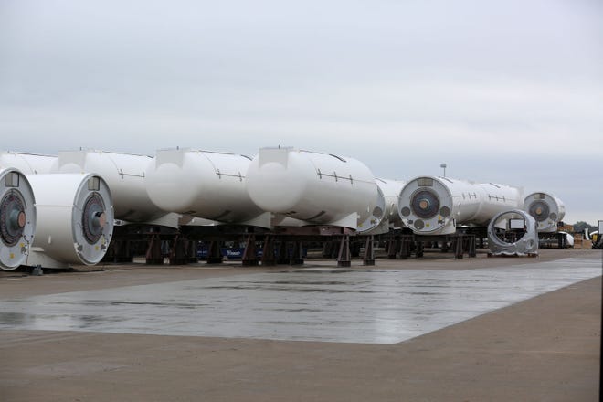 Wind nacelles sit in the lot at the Siemens Gamesa plant in Hutchinson in this file photo. The company announced it received a new order for 76 nacelles for a Texas wind farm.