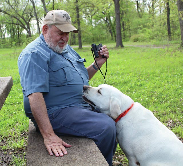 Gary Lantz sits with his dog, Cody, at Lake Pawhuska. Robert Smith/Journal-Capital