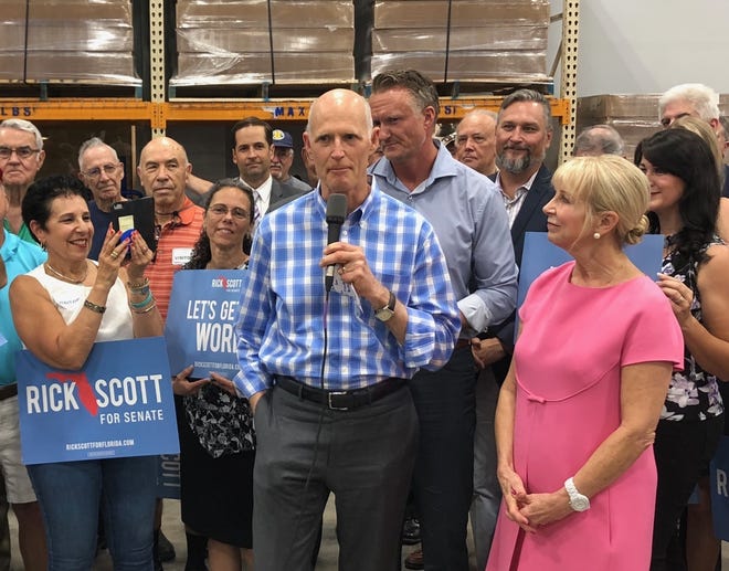 Gov. Rick Scott, center, marks the first month of his U.S. Senate campaign with a stop Wednesday at PGT Innovations in Venice. [Herald-Tribune staff photo / Zac Anderson]