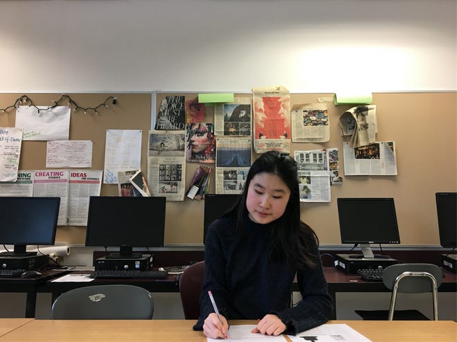 Algonquin Regional High School senior Cassidy Wang is hard at work as a student journalist. [Submitted Photo]