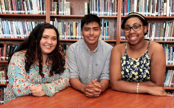 Battle High School students who received EdX Grow Our Own Teachers Program scholarships are, from left, Olivia Zacharias, Columbia College; Fernando Jimenez, Central Methodist University; and Serenity Washington, University of Missouri. The program is designed to groom minority teachers in Columbia Public Schools from the current student body. [Don Shrubshell/Tribune]