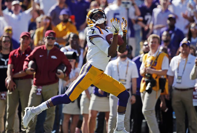 LSU receiver D.J. Chark (7) catches a touchdown against Arkansas on Nov. 11 in Baton Rouge, La. Chark is one of about 60 players who will participate in the Jaguars' rookie minicamp beginning Friday. [AP Photo/Gerald Herbert]