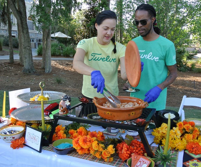 Candace Bradshaw and Nakivio Poole, the TacoLu catering crew, made sample size Bangin' Shrimp Tacos for a recent media tasting. The Jacksonville Beach restaurant's popular Tacos on 12 feature has been a fixture at The Players for years, and has grown to about 40 tables for the 2018 tournament. [JACKIE ROONEY/FOR SHORELINES]