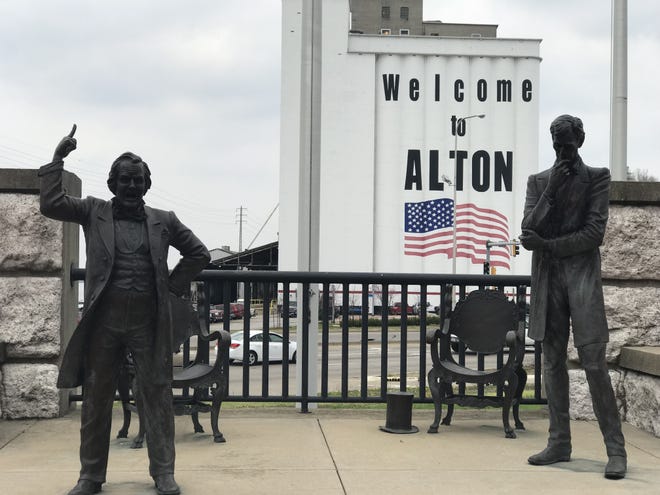 Statues of Abraham Lincoln and Stephen Douglas mark the site of the last of their famous debates in Alton, Ill. [Rick Holmes]
