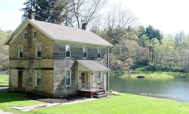 Hidden Valley Lake Retreat, a 57 acre property with a lodge, bank barn and stone home in Paris, Ohio will be auctioned Saturday. (CantonRep.com / Michael Balash)