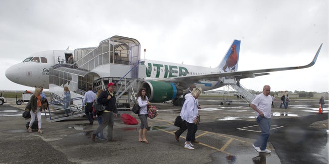 Passengers arrive at the Northeast Florida Regional Airport in St. Augustine in 2016 on a Frontier Airlines Flight in 2016. [PETER WILLOTT/THE RECORD]