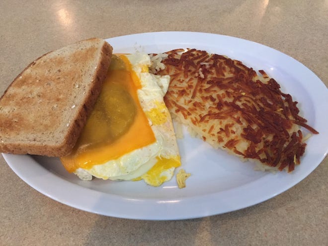 The breakfast sandwich with a side of hashbrowns from Keefner's Sandwiches, Suds & Stories.