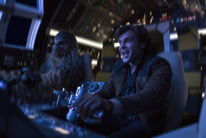 In this image released by Lucasfilm, Alden Ehrenreich, right, and Joonas Suotamo appear in a scene from "Solo: A Star Wars Story," which will premiere at the Cannes Film festival in southern France. (Jonathan Olley/Lucasfilm via AP)