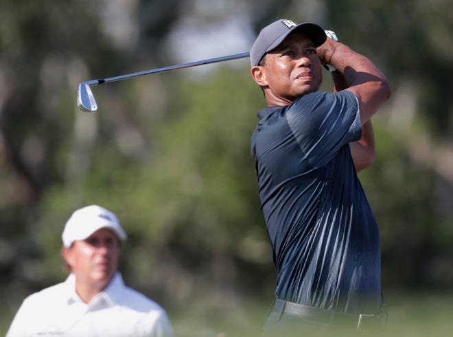 Tiger Woods hits from the 12th tee during the second round of The Players Championship golf tournament Friday, May 11, 2018, in Ponte Vedra Beach, Fla. (AP Photo/Lynne Sladky)