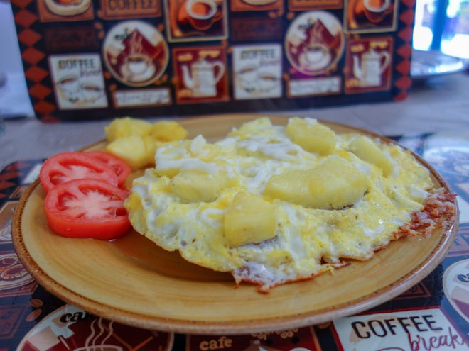 For a unique breakfast taste, the Croque Hawaii ($6.50) is an open-face omelet studded with cheese and pineapple chunks atop a grilled ham and cheese sandwich. [Jay Magee/for the Times-Union]