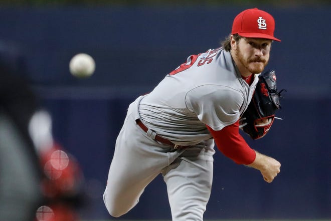 St. Louis Cardinals starting pitcher Miles Mikolas watches a throw to a San Diego Padres batter during the first inning of a baseball game Thursday, May 10, 2018, in San Diego. (AP Photo/Gregory Bull)