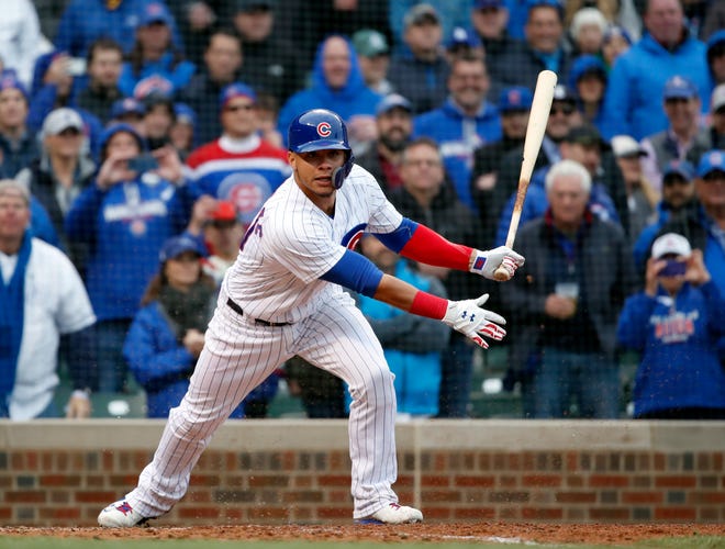 Chicago Cubs catcher Willson Contreras watches his double in the seventh inning of a baseball game against the Chicago White Sox in Chicago, on Friday, May 11, 2018. (AP Photo/Jeff Haynes)