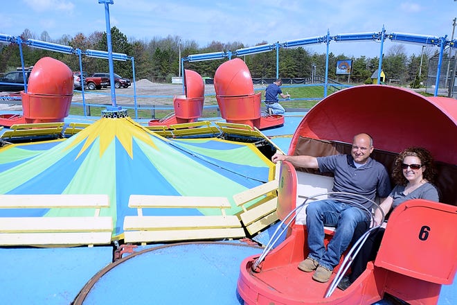 Jason and Dawn Dlugokecki sit inside of one of the cars on the Tilt-A-Whirl at Funtimes Fun Park on Friday, May 4. The Tilt-A-Whirl formerly was at the now-closed Geauga Lake and will be available for rides beginning at the grand reopening of Funtimes this Saturday.