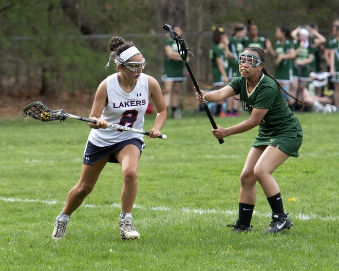 Apponequet's Lily Gendron look to attack the as GNBVT's Julymar Rodriguez looks to stop her during Friday's game in Lakeville. The Lady Lakers were 15-4 winners. [Bud Morton/The Gazette/SCMG]
