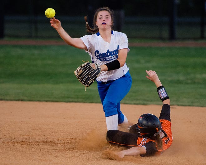 North Davidson's Bailey Leonard slides to attempt to prevent a double-play after a force-out at second base by R-S Central shortstop Sara Holmstrom on Saturday. [Donnie Roberts/The Dispatch]