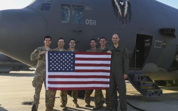 Crew members with the 4th Special Operations Squadron stand in front of AC-130U Spooky gunship tail number 89-0511 at Hurlburt Field on Tuesday. It flew on its final flight to the 309th Aerospace Maintenance and Regeneration Group, known as the aircraft boneyard, at Davis-Monthan Air Force Base, Ariz., after 29 years of service. [U.S. Air Force photo by Airman 1st Class Rachel Yates]