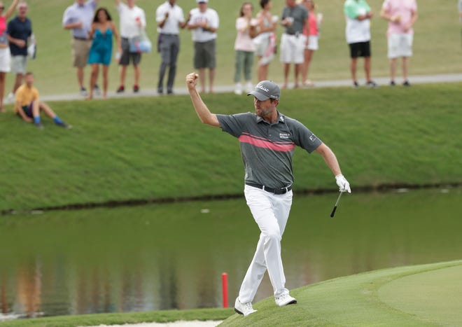 Webb Simpson celebrates an eagle shot on the 11th hole during the third round of The Players Championship golf tournament Saturday, May 12, 2018, in Ponte Vedra Beach, Fla. (AP Photo/John Raoux)