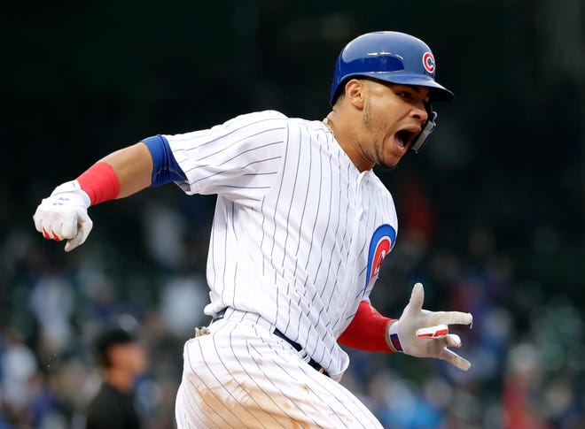 Chicago Cubs catcher Willson Contreras reacts as he rounds the bases after hitting a two-run home run against the Chicago White Sox in the seventh inning of Saturday's game. [Nam Y. Huh/The Associated Press]