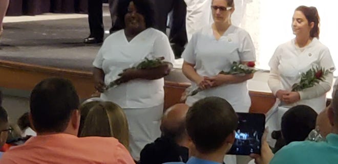 Oweeta Price, left, at a pinning ceremony at LCC. Submitted photo