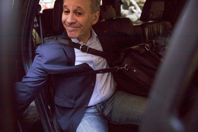 Former New York Attorney General Eric Schneiderman leaves his apartment building on Wednesday. Schneiderman resigned Monday, just hours after accounts of abuse by four women. (AP Photo/Mary Altaffer)