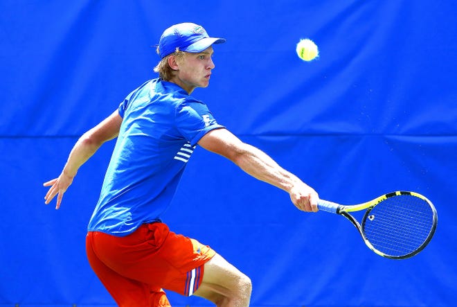 Florida's Johannes Ingildsen returns a ball during the first round of the NCAA Tournament against South Carolina State at the Ring Tennis Complex on the UF campus Saturday. [Brad McClenny/Staff photographer]