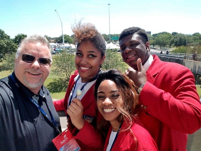 SkillsUSA competitors and an advisor take time for a selfie in Pensacola at the state competition. [Facebook]