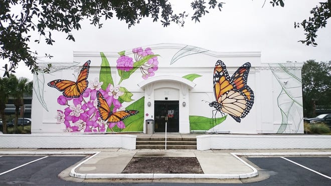 The "Milkweed Galaxy" mural at Full Sail University presented by The Nature Conservancy. Efforts are underway in Central Florida to restore the habitats of the monarch butterfly, crucial to helping plants grow, including many foods people eat. The iconic orange and black insect is one of nature's key pollinators. Environmentalists say its decline, which they blame in part on climate change, threatens the ecological health of the region, and other crucial insects may be suffering as well. (Sarah Espedido /Orlando Sentinel via AP)