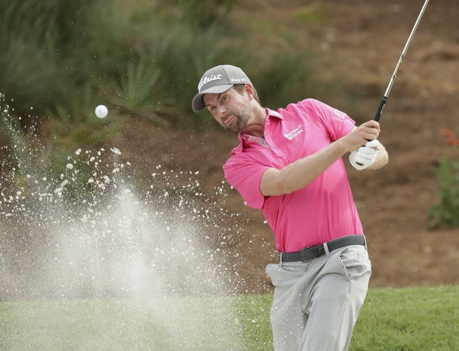 Webb Simpson hits from an eighth hole sand trap, during the final round of the The Players Championship golf tournament Sunday in Ponte Vedra Beach. [AP Photo/John Raoux]